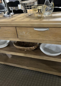 Low wooden console table with basket, bowls