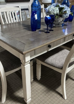Farmhouse dining table with blue glass vases