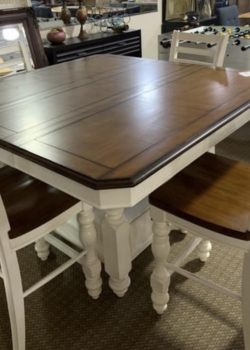 Stained wood tabletop with white turned legs