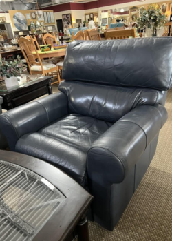 Deep blue leather recliner in showroom