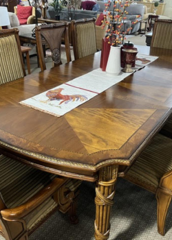Carved wood dining table with rooster runner