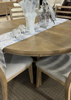 Wooden dining table with ceramic sheep ornaments