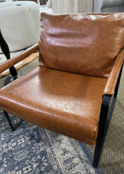 Caramel leather lounge chair with black frame